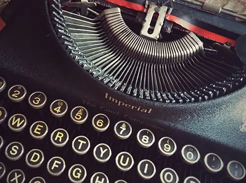 AUthor Vintage typewriter with round keys and Imperial logo.
